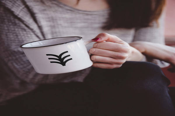 Hand Holding Metal Mug Mockup