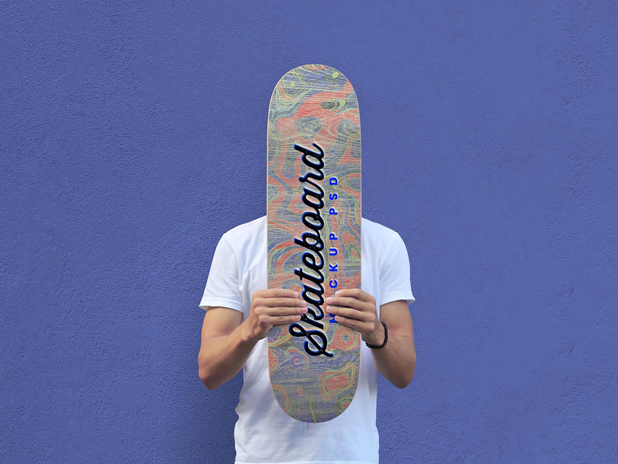 Man Holds Skateboard Mockup