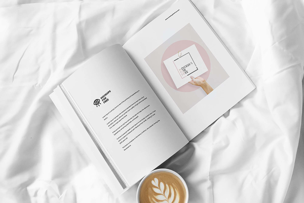 Magazine on White Bed Mockup