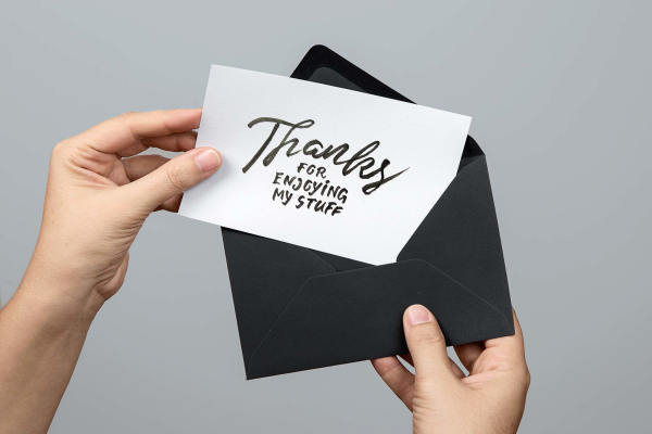 Greeting Card in Hand Mockup