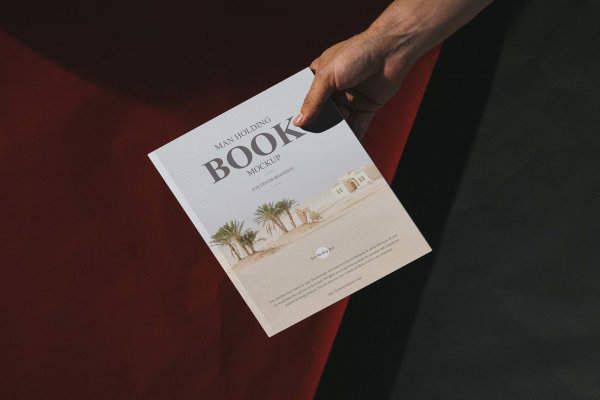 Man Holding Book Mockup