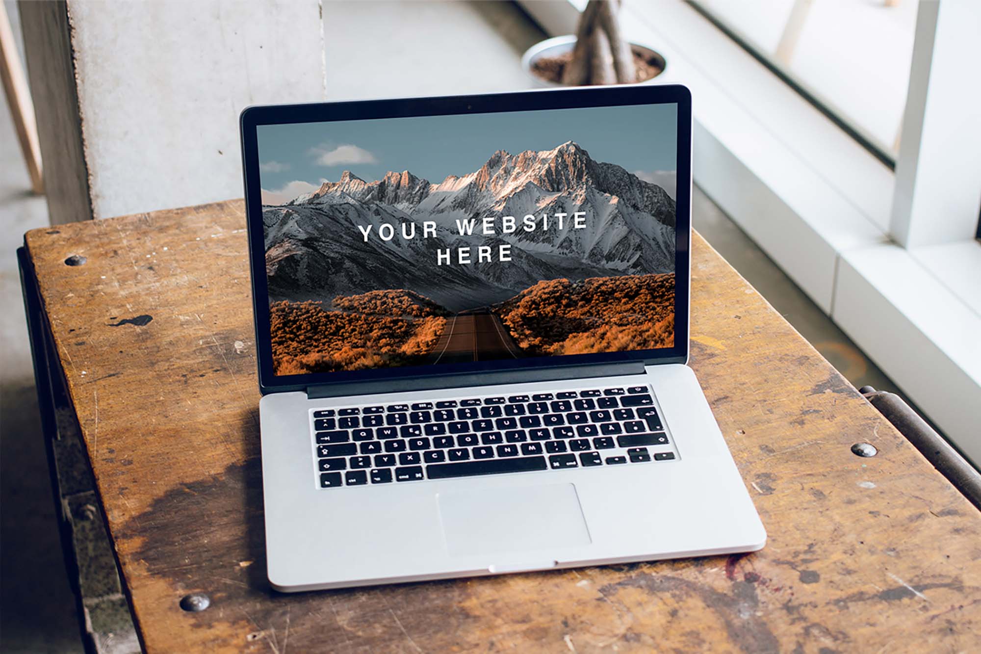 New MacBook Pro on Table Mockup